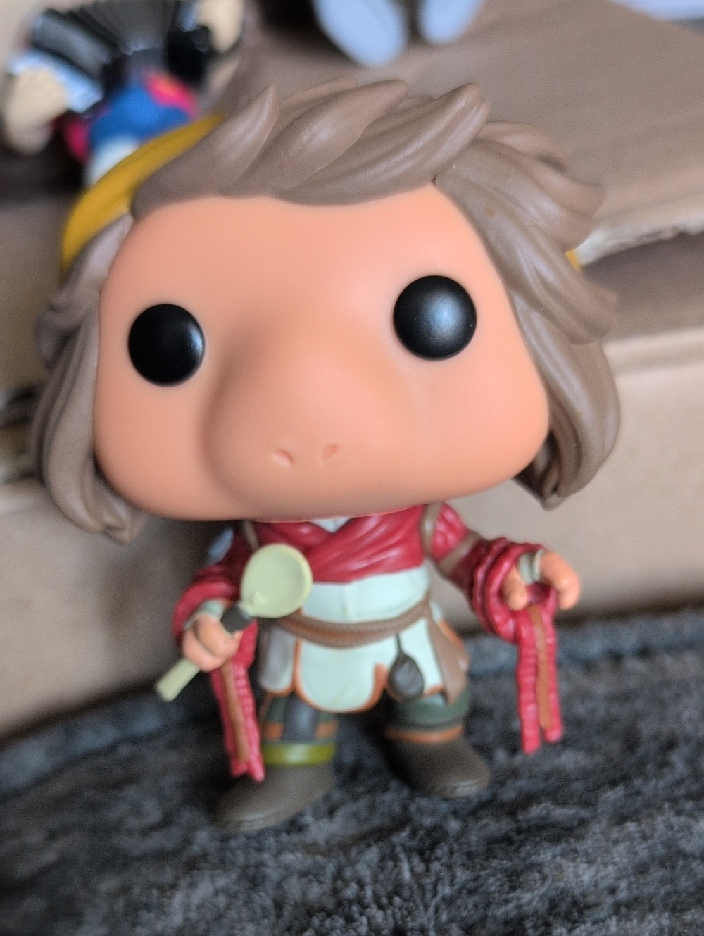 Funko Vinyl Figure with Brown Hair and Red Outfit